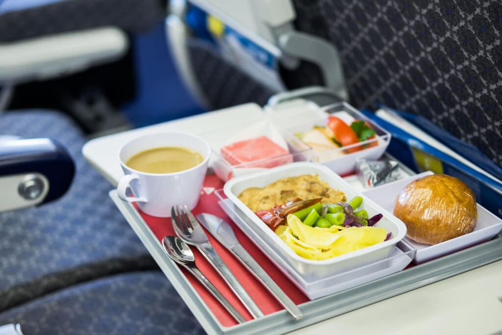 Qantas will start serving vegetarian meals on all domestic flights again after a backlash from travellers.