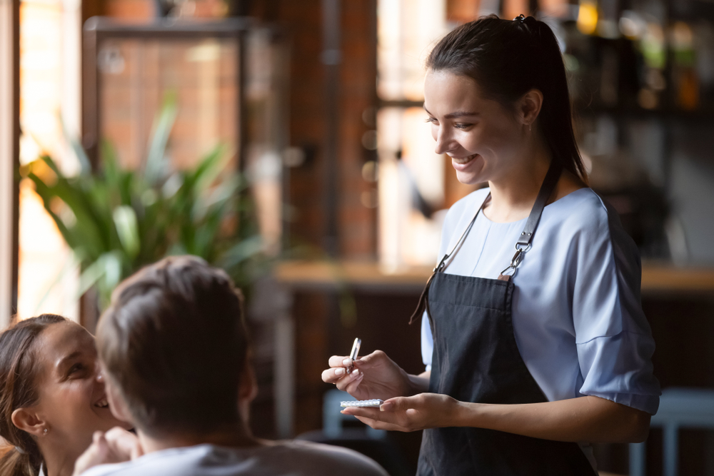 Smiling,Female,Waitress,Take,Order,Talk,To,Clients,Cafe,Restaurant