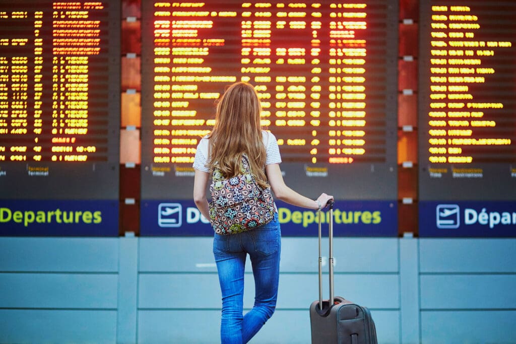 Beautiful,Young,Tourist,Girl,With,Backpack,And,Carry,On,Luggage