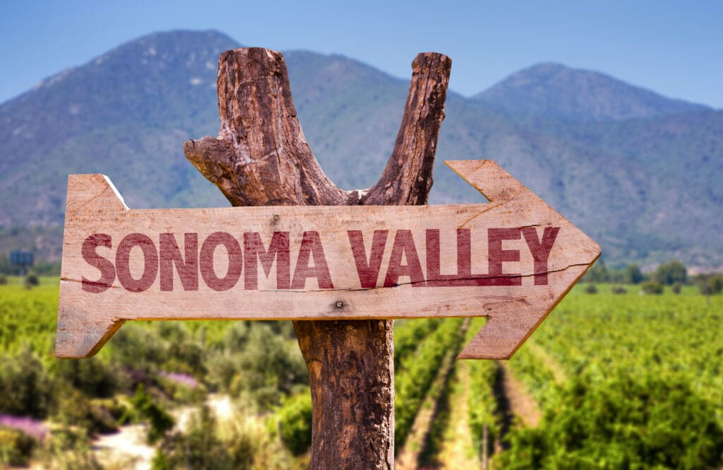 Sonoma,Valley,Wooden,Sign,With,Winery,Background