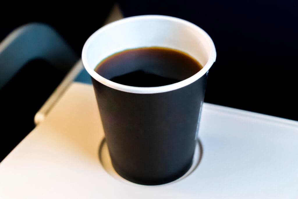 Black,Cup,Mug,With,Black,Coffee,To,Take,On,Plane