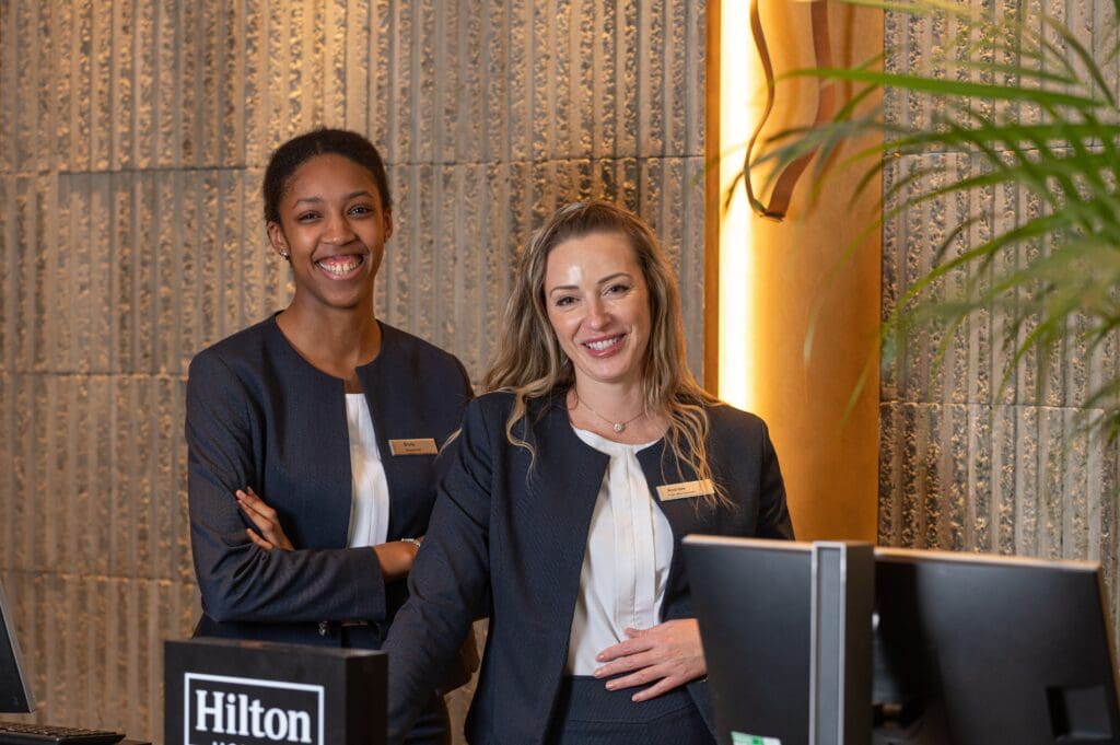 Hilton-Team-Members-at-Front-Desk