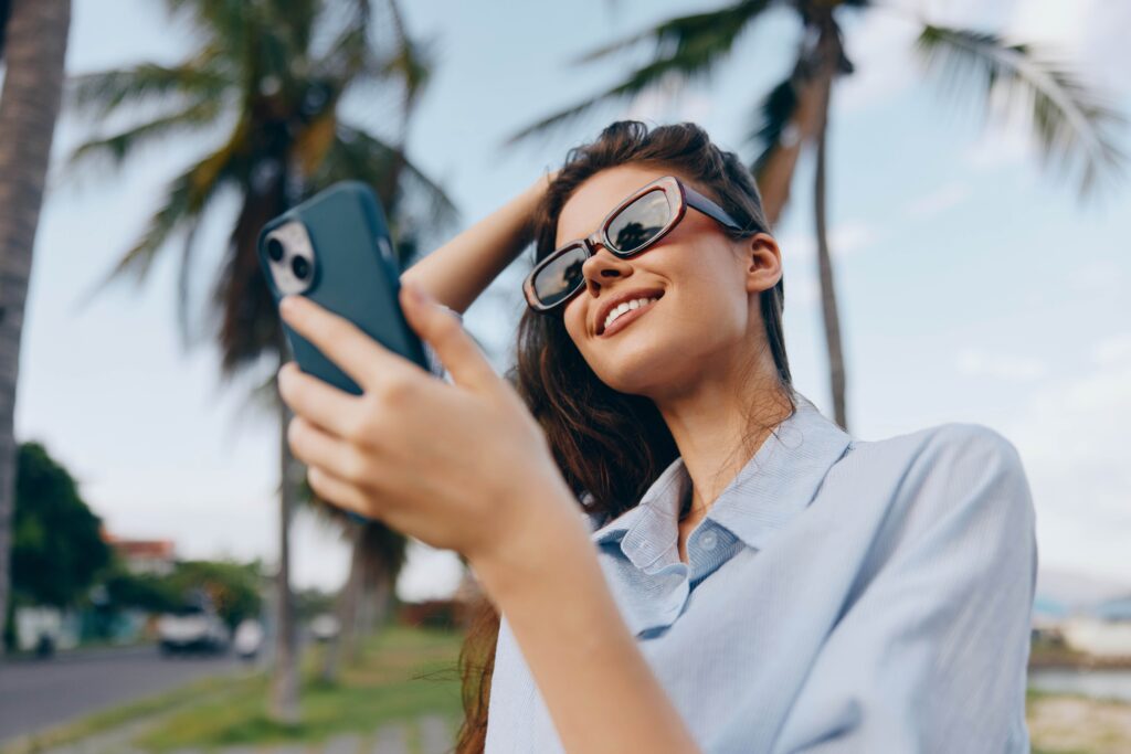 Woman,Selfie,,Sunglasses,,Palm,Trees,,Street,Sign,A,Woman,Wearing