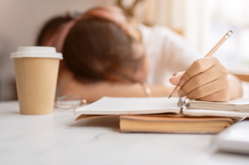 A,Tired,,Sleepy,Young,Asian,Female,College,Student,Holds,A